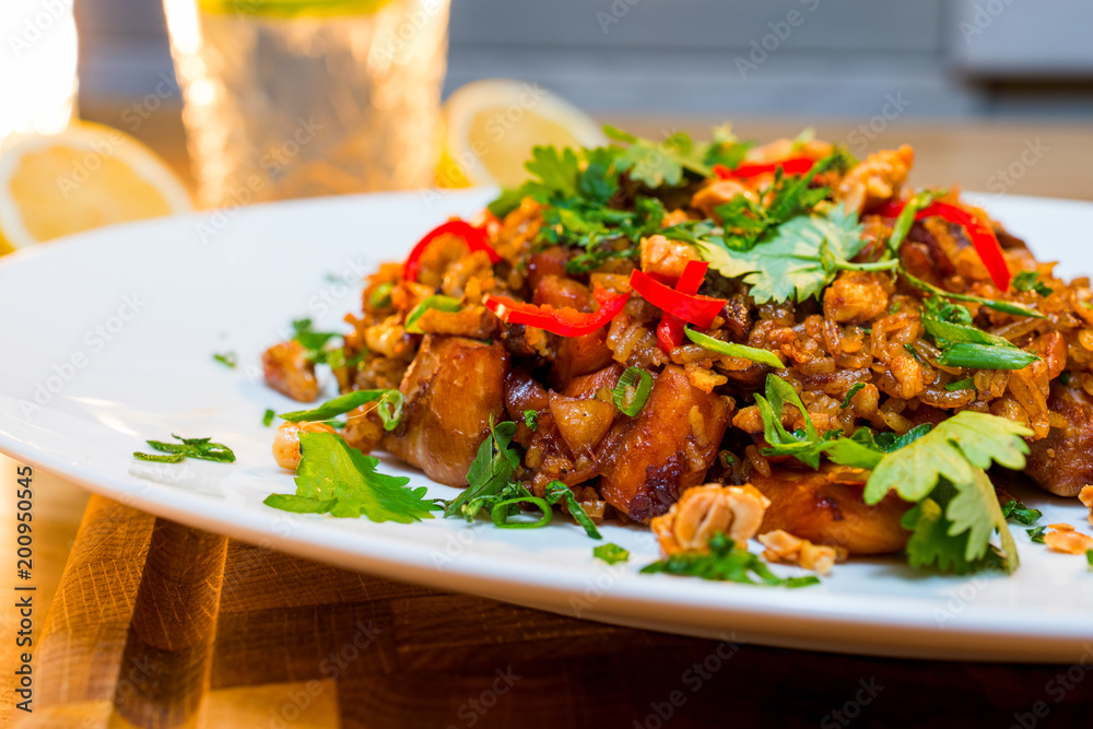 Rice with meat fried in an oriental recipe in sauce