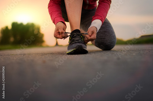 Runner trying running shoes getting ready for jogging