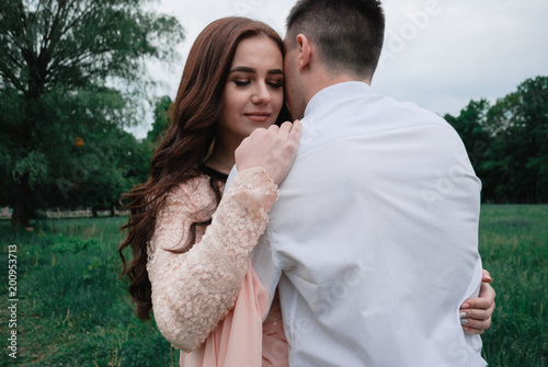 Nice outdoor wedding photography of young beutiful couple in summer park