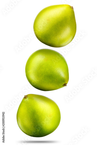 Falling green pomelo citrus fruit isolated on white background with plipping path