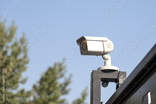 Street surveillance camera on the fence.