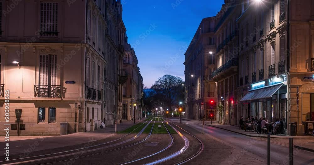 Time-lapse video of evening Reims city center with transport motion and sunset, France Time-lapse video of evening Reims city center with transport motion and sunset, France