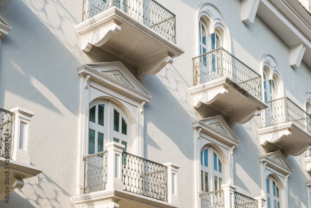 Obraz premium balcony and windows on beautitful restored historic facade - rel estate exterior