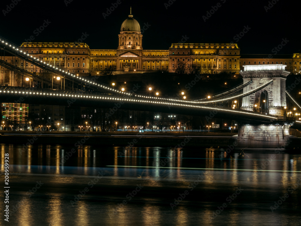 Chain Bridge with the Royal Palace in the background in Budapest at night