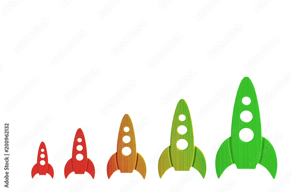 Rockets color from red to green are in order of increasing on a white background. The concept of space and technology, travel to the stars and other planets. Space tourism. Launch of spaceships.