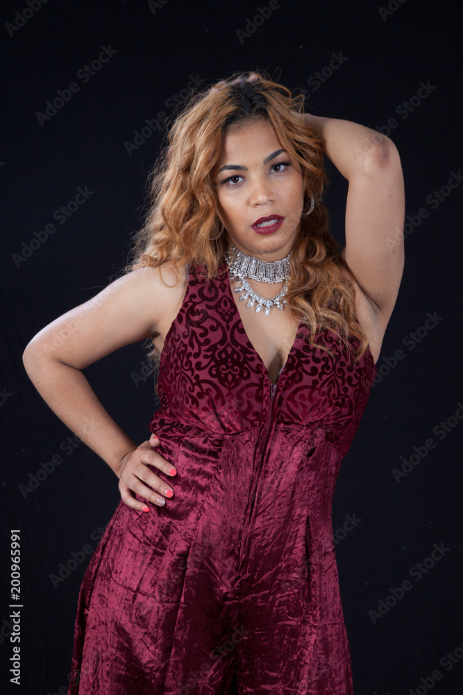 Pretty woman looking thoughtful with her hand on her hip Pretty woman looking thoughtful with her hand on her hip