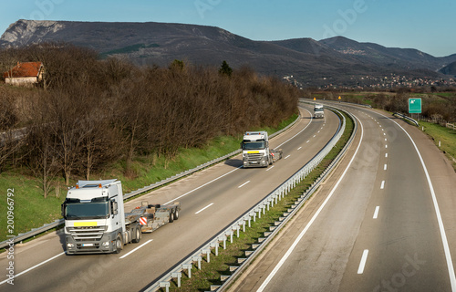 Convoy of Semi Trucks without trailers in country highway Traffic