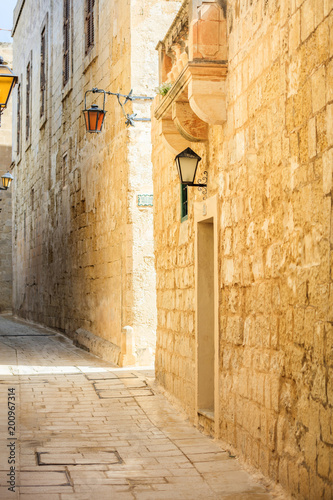 Fototapeta Naklejka Na Ścianę i Meble -  Malta, Mdina. Old medieval city narrow streets, houses sandstone facades