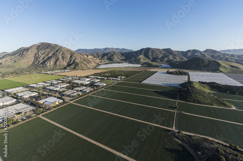 Aerial view of Camarillo farm fields, industrial buildings and the Santa Monica Mountains in Ventura County, California. 