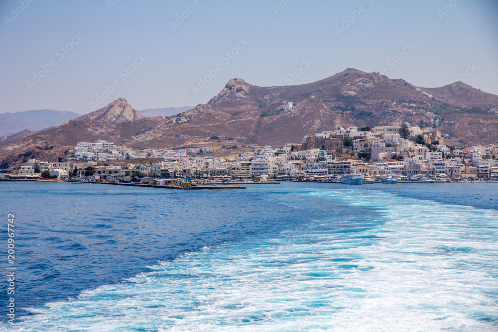 Fototapeta premium Trail of frothy blue sea leaving Naxos on ferry.