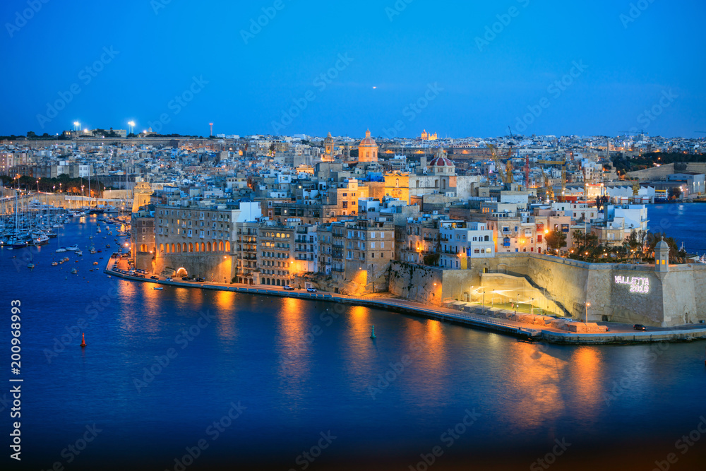 Valletta, Malta. View of Grand harbor from Upper Barrakka Gardens in the evening