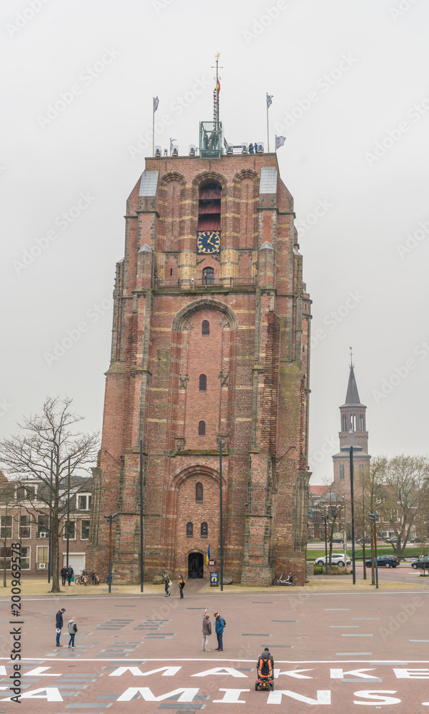 Fototapeta premium Leeuwarden, The Netherlands, april 14 2018, People visiting the famous sagged Oldenhove tower