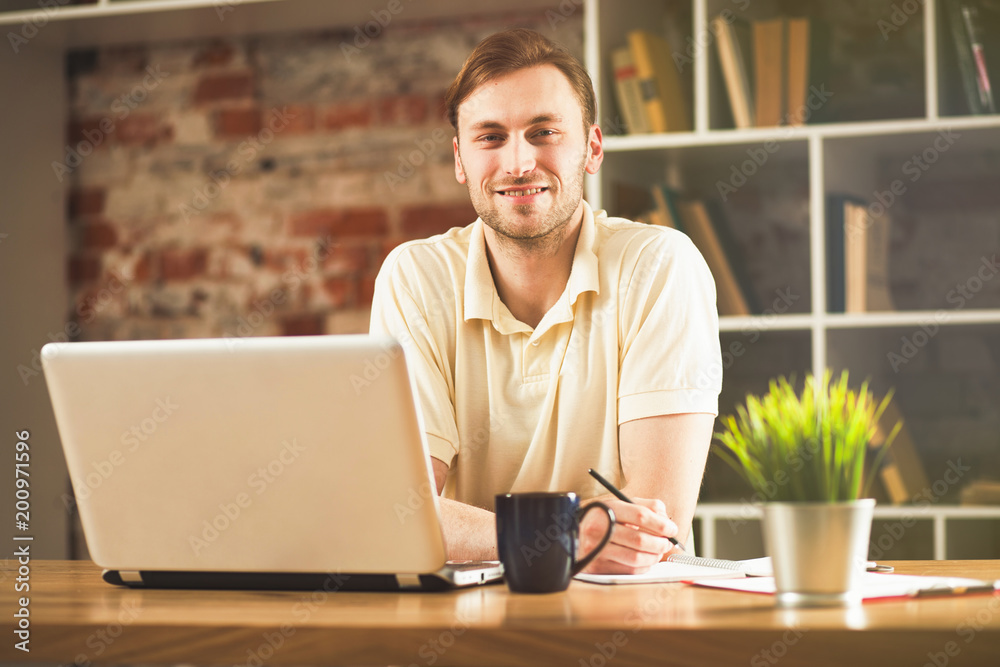 Young man with a laptop Young man with a laptop