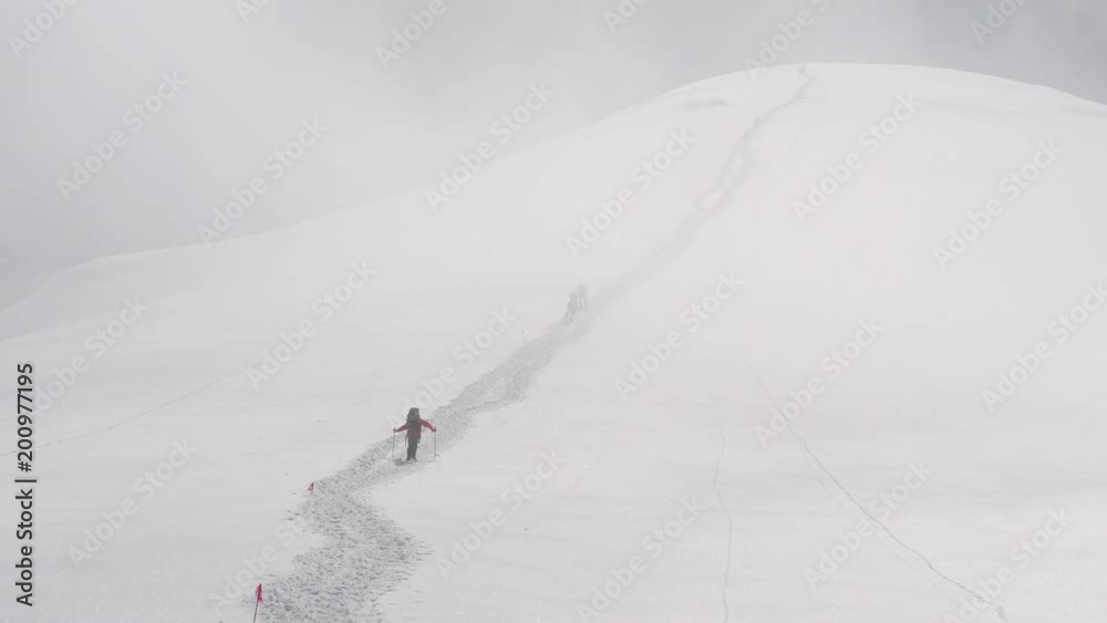Extreme mountain climbing in blizzard conditions adventure expedition Extreme mountain climbing in blizzard conditions adventure expedition