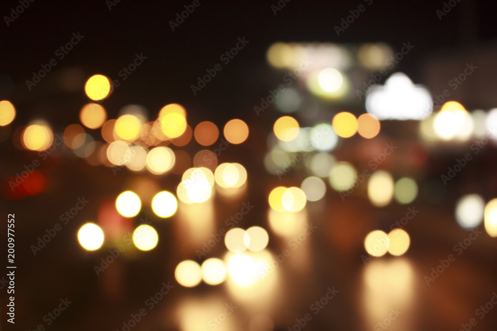 Gold bokeh abstract light background from car on road.