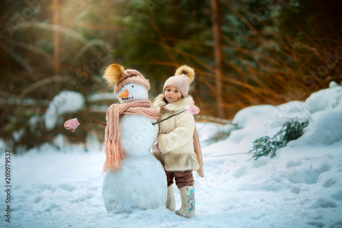 4065029 Little girl with snowman