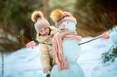 4065030 Little girl with snowman