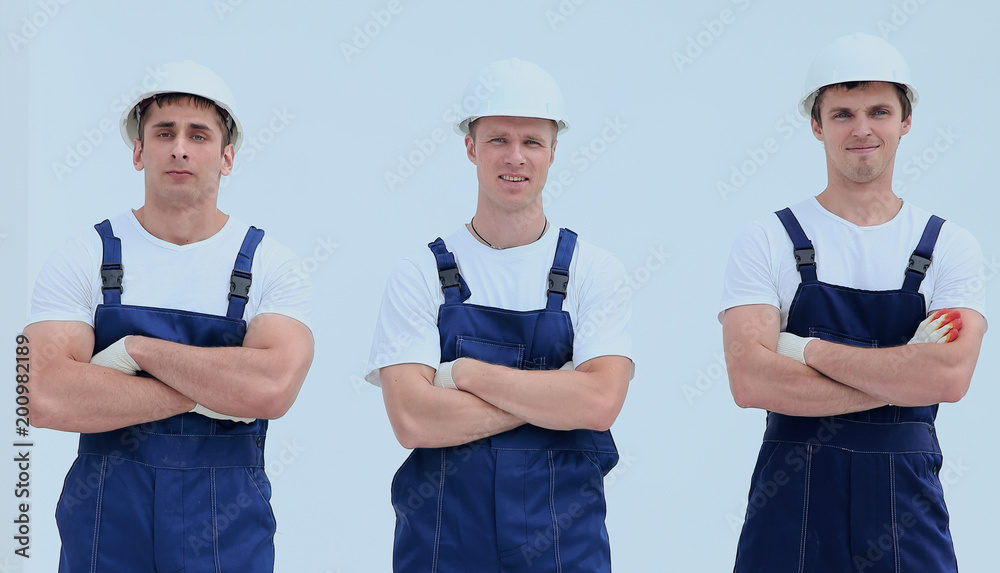 Fototapeta premium successful team builders in overalls and helmets