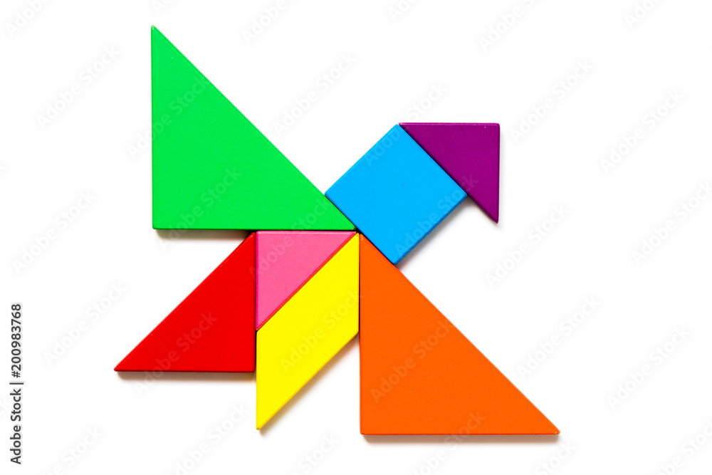Color wood tangram puzzle in flying bird shape on white background
