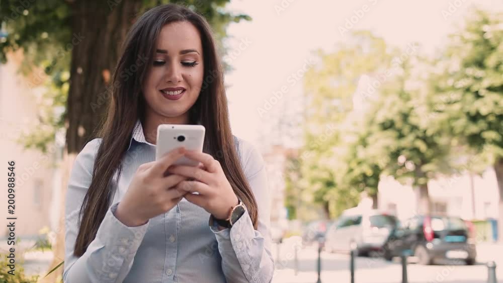 Young Business Woman Using Smartphone While Sitting Outdoor Young Business Woman Using Smartphone While Sitting Outdoor