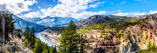 Panorama of the famous Fraser Canyon Route following the Thompson River as it flows through the snow covered mountains of the Coastal Mountain Range in western British Columbia, Canada