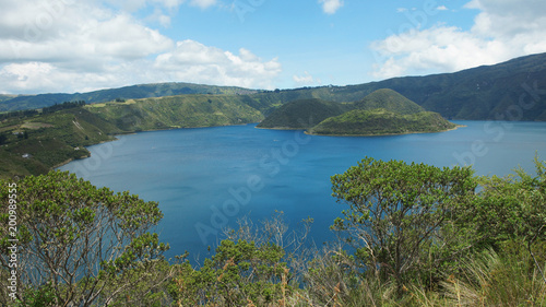 Panoramic view of the Cuicocha lagoon in the province of Imbabura. Cuicocha is a 3 km wide caldera and crater lake at the foot of Cotacachi Volcano in the Cordillera Occidental of the Ecuadorian Andes photo