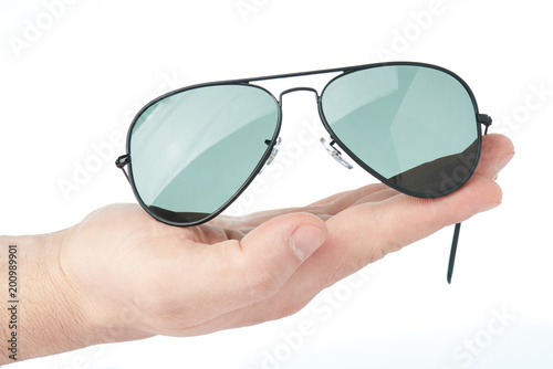 4067649 Sunglasses lay on hand palm