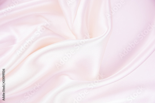 The texture of the satin fabric of pink color for the background 