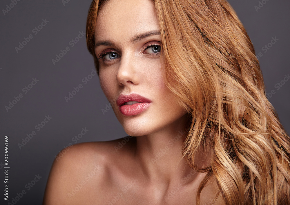 Fototapeta premium Beauty fashion portrait of young blond woman model with natural makeup and perfect skin posing in studio