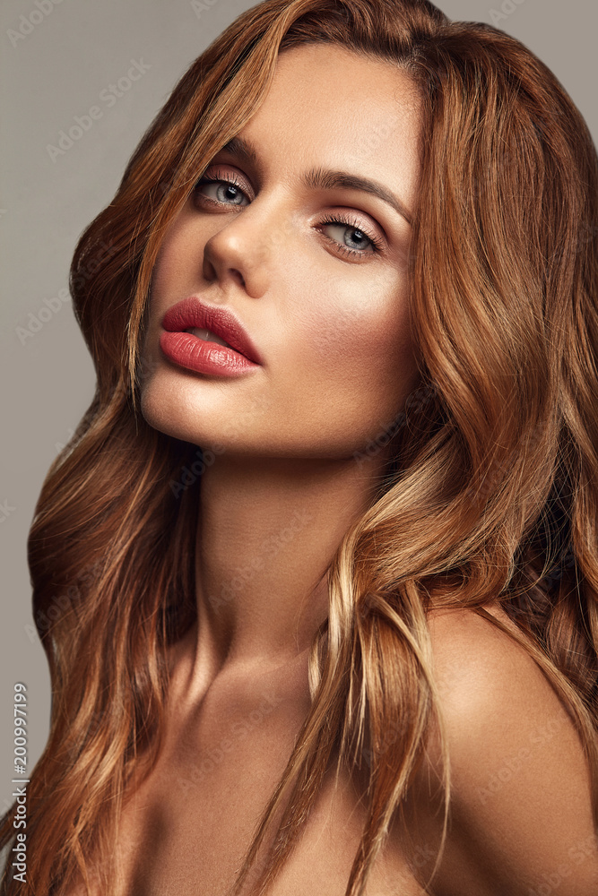 Beauty fashion portrait of young blond woman model with natural makeup and perfect skin posing in studio Beauty fashion portrait of young blond woman model with natural makeup and perfect skin posing in studio