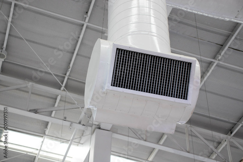 white air conditioner on the ceiling in the shopping mall.