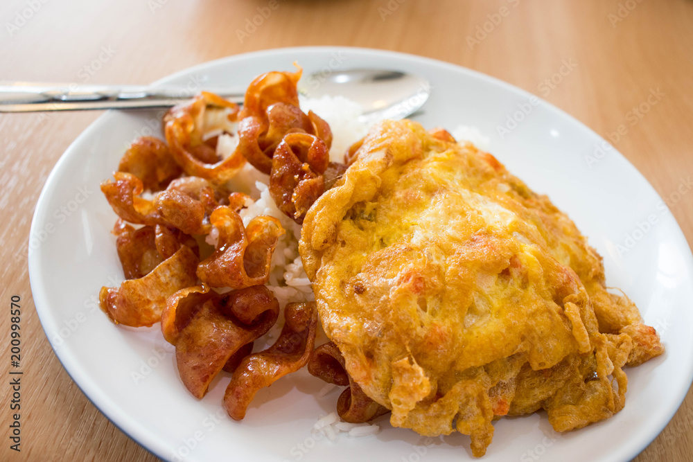 Chinese sausages and omelet topping on rice. Chinese sausages and omelet topping on rice.
