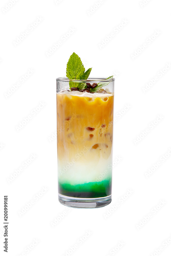 A multicolored, three-layered opaque cocktail in a tall glass with crushed ice and mint leaves and coffee beans, with the taste of menthol, coffee, caramel, cream. Side view. Isolated white background A multicolored, three-layered opaque cocktail in a tall glass with crushed ice and mint leaves and coffee beans, with the taste of menthol, coffee, caramel, cream. Side view. Isolated white background