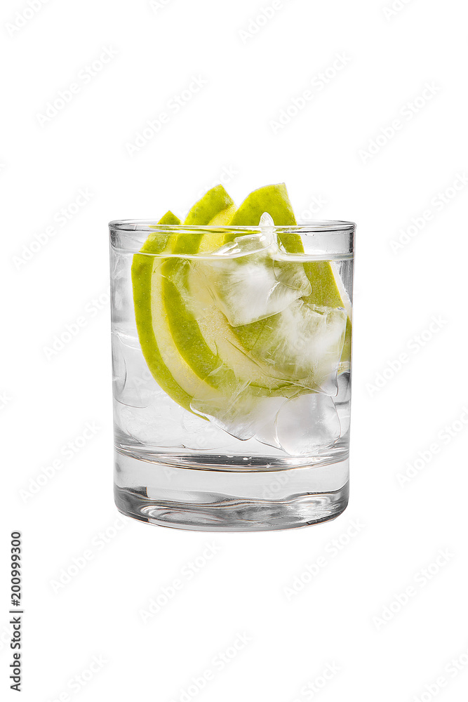 Transparent cocktail, refreshing water in a low glass with ice cubes and three semicircles slices of a green apple. Side view. Isolated white background. Drink for the menu restaurant, bar, cafe Transparent cocktail, refreshing water in a low glass with ice cubes and three semicircles slices of a green apple. Side view. Isolated white background. Drink for the menu restaurant, bar, cafe