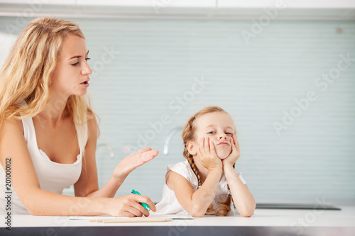 Parent helps the child to do homework