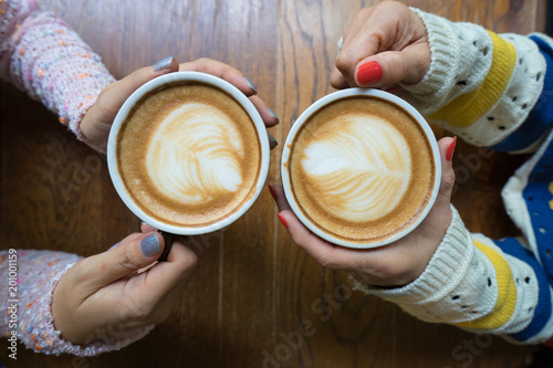 Latte coffee art and people meeting friendship togetherness coffee shop concept