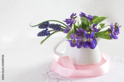 beautiful small bouquet of forest violets in a vase