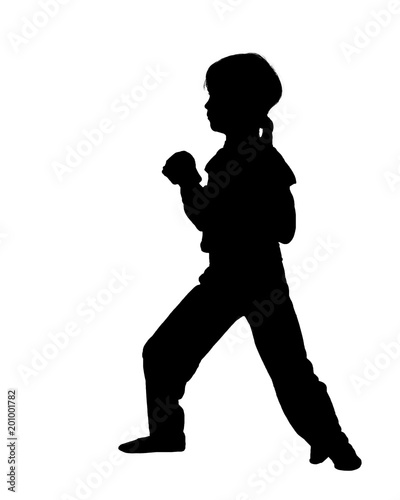 Black silhouette of young ninja fighting on white background
