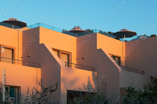 Building with balconies and terraces.