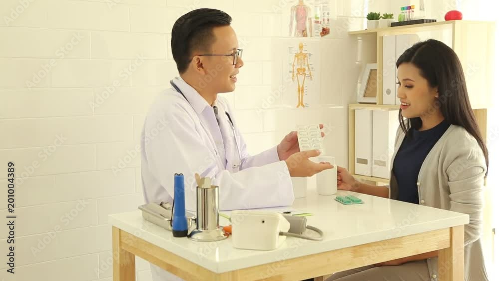 Asian male doctor Patient examination Woman in hospital Asian male doctor Patient examination Woman in hospital