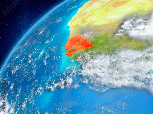 Space view of Senegal in red