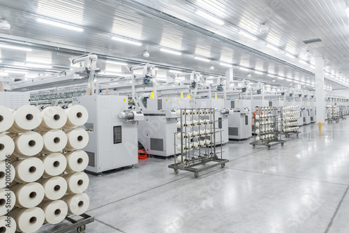 Machinery and equipment in the workshop for the production of thread, overview. interior of industrial textile factory