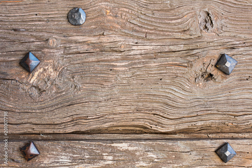 old wooden door with iron forged rivets photo