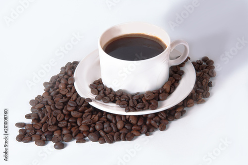 Coffee cup and beans on old kitchen table. Top view with copyspa