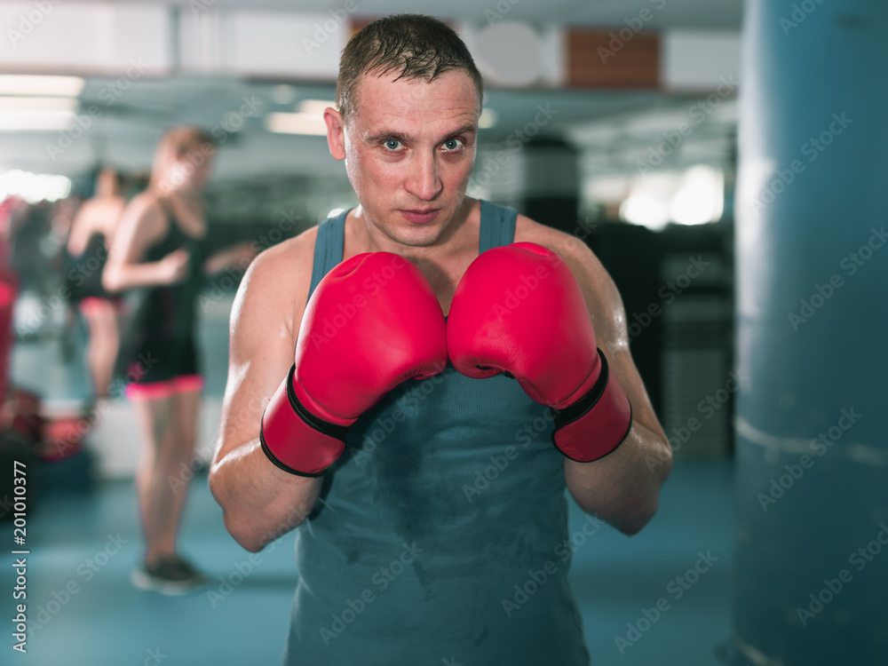 Portrait of adult male who is boxing