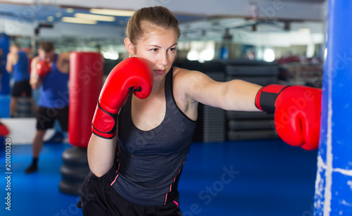 Woman boxing in gym © JackF