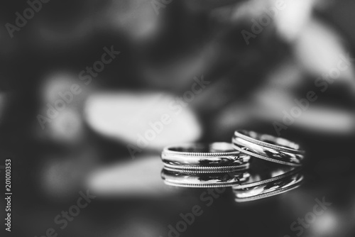 Closeup photo of wedding rings lying on the table