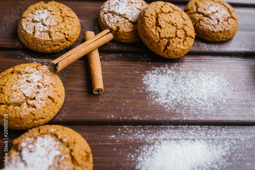 Photography Oatmeal cookies on a wooden table in castor sugar, copy space