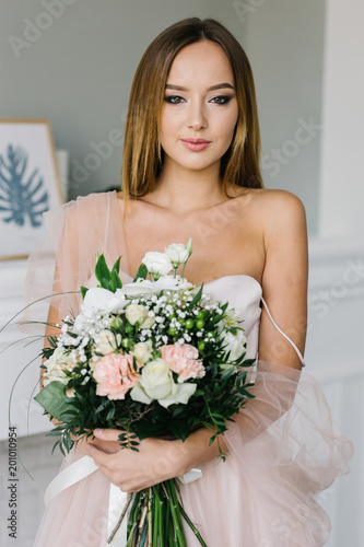 Young girl holds the bouquet