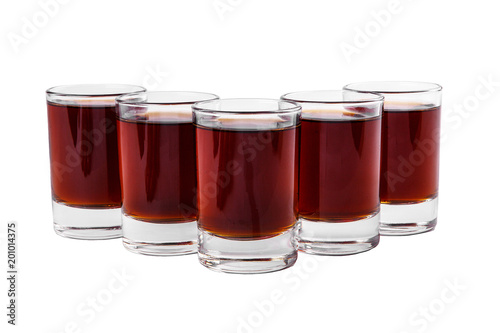 Monochrome transparent cocktails, a set of shots pile, wedge, five servings, with a taste of berries, cherries, strawberries, greiprut, cola. Side view Isolated white background.